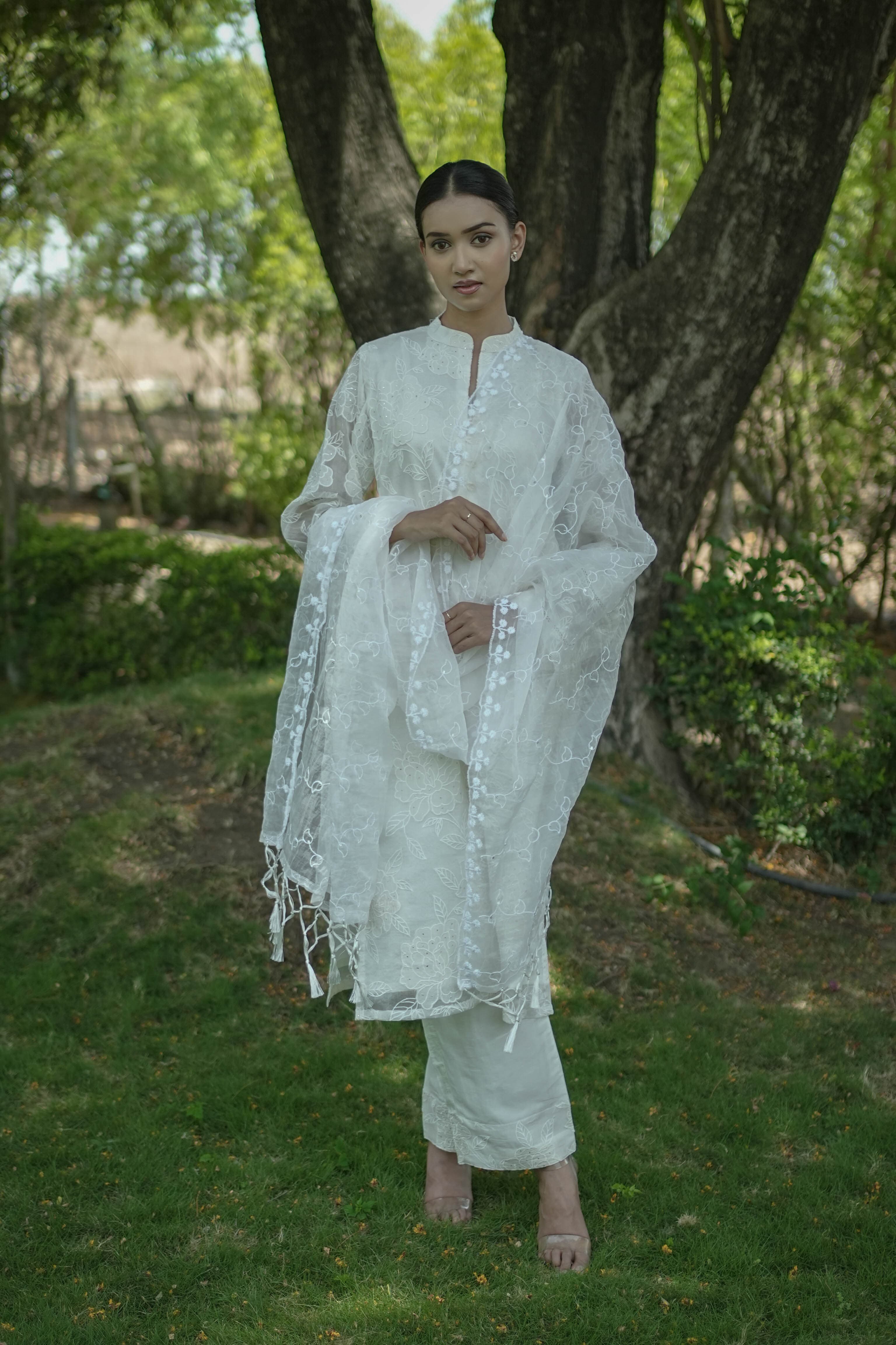 Woman wearing the Moonflower white organza kurta set with tonal floral embroidery